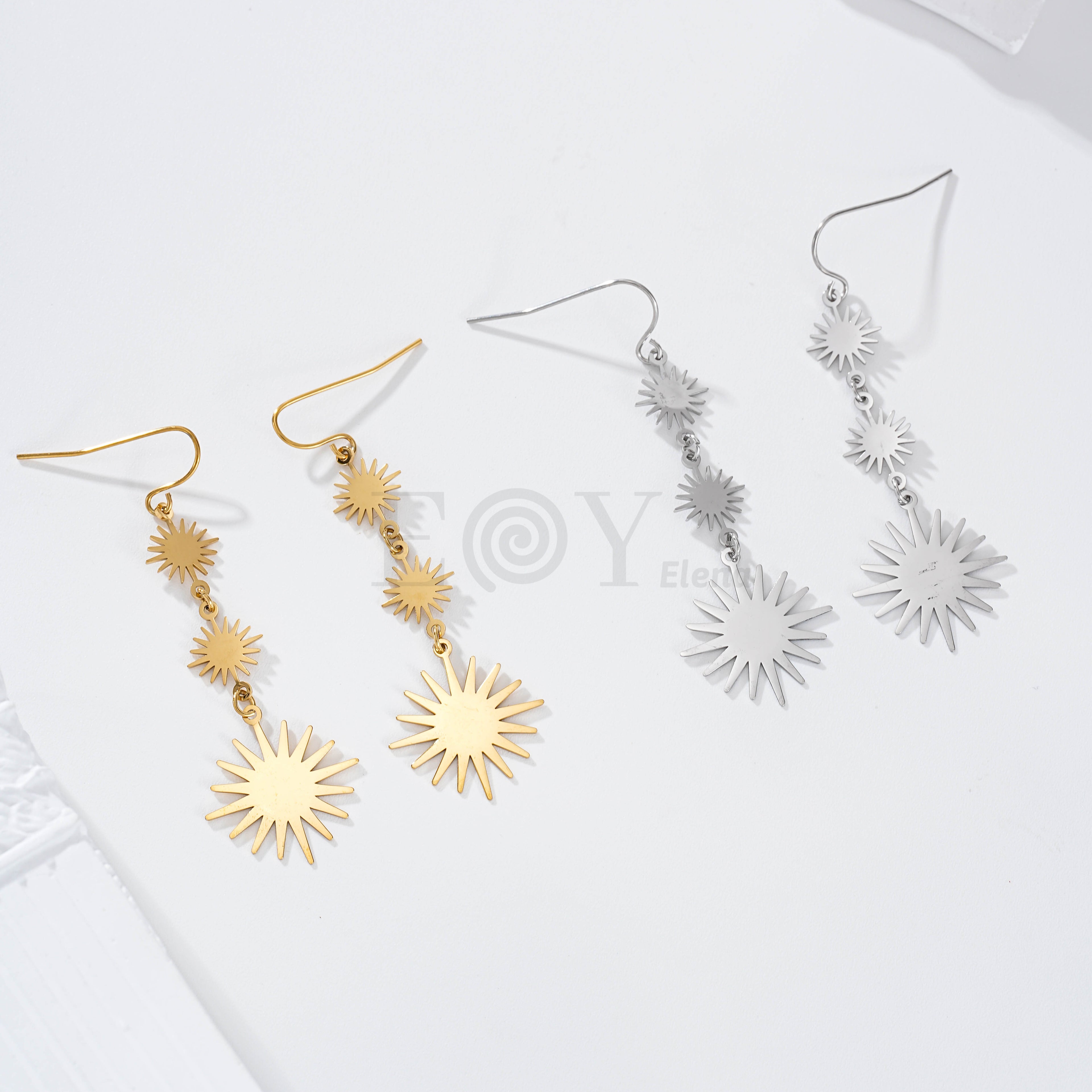Pendientes tres soles acero