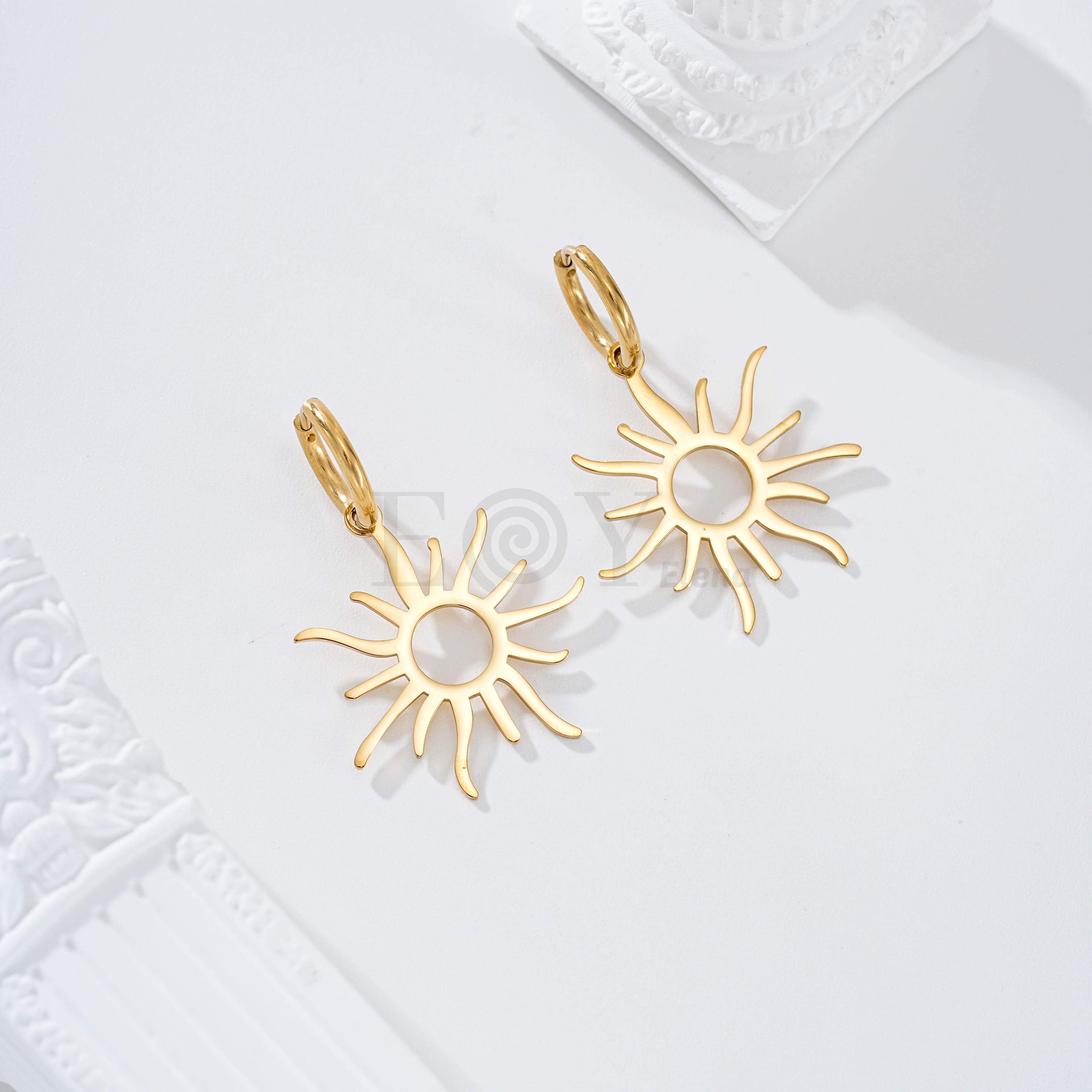 Pendientes de aro con sol acero