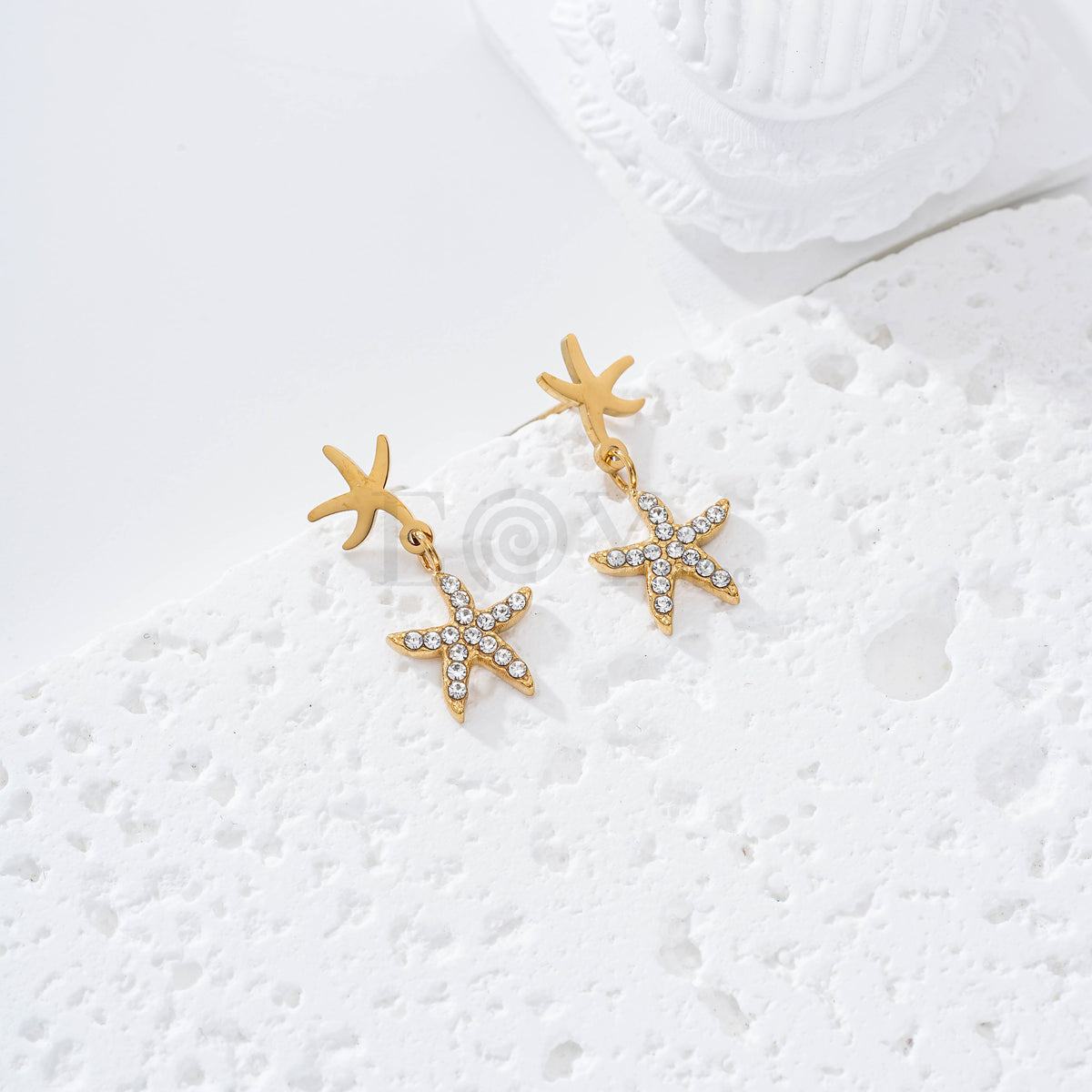 Pendientes doble estrella de mar circonitas acero
