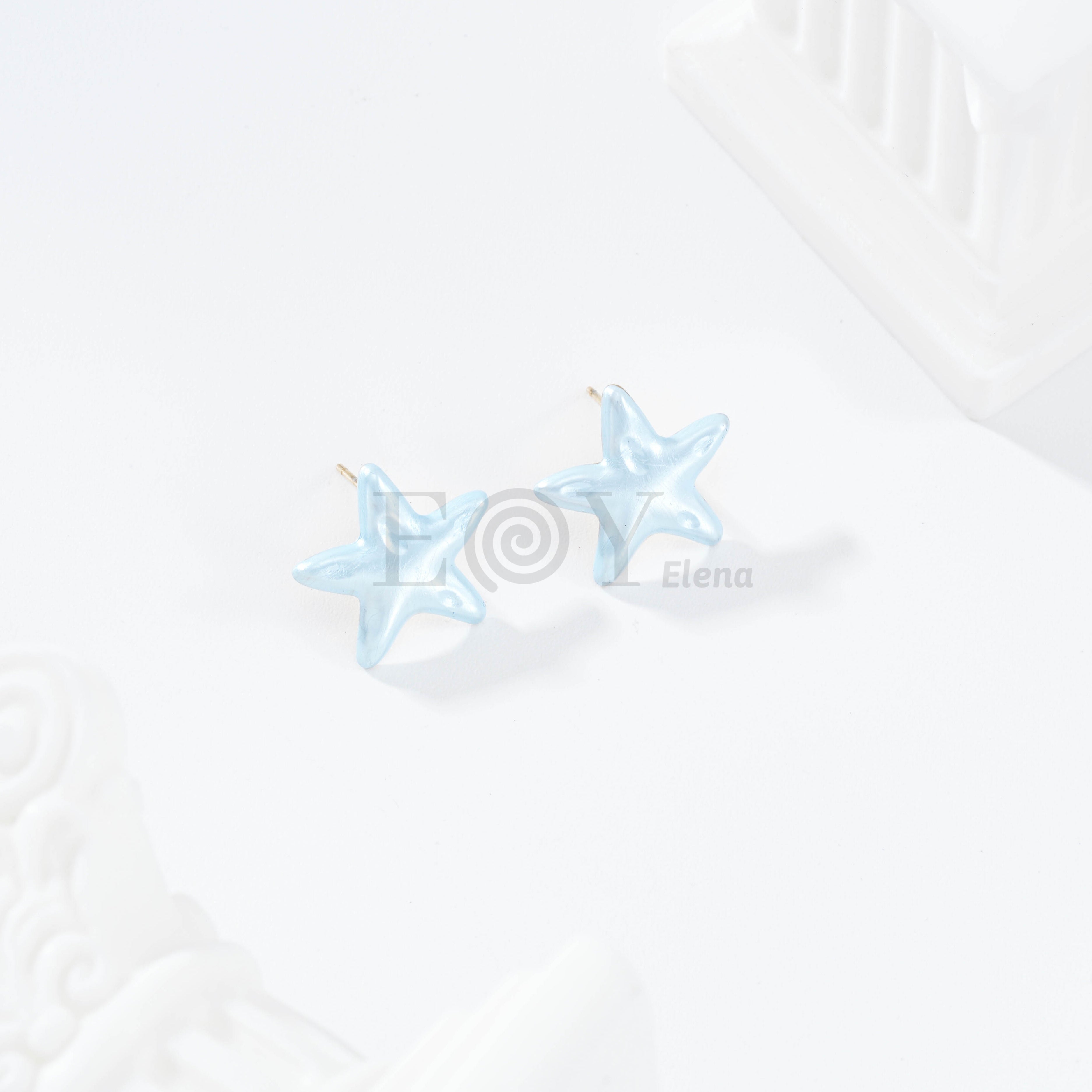 Pendientes estrella color