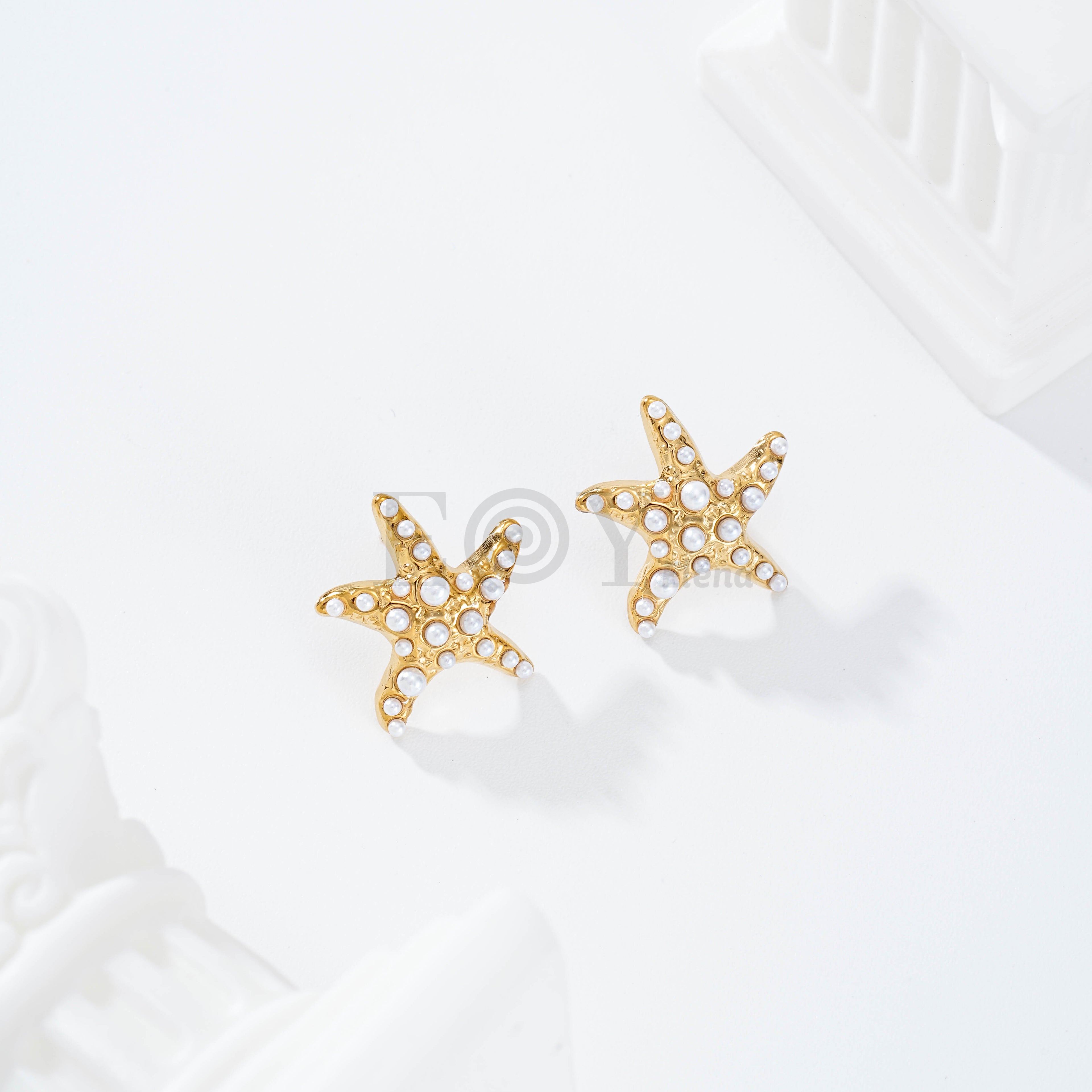 Pendientes estrella de mar con perlas