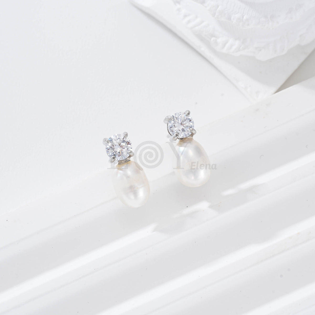 Pendientes circonita redonda y perla acero
