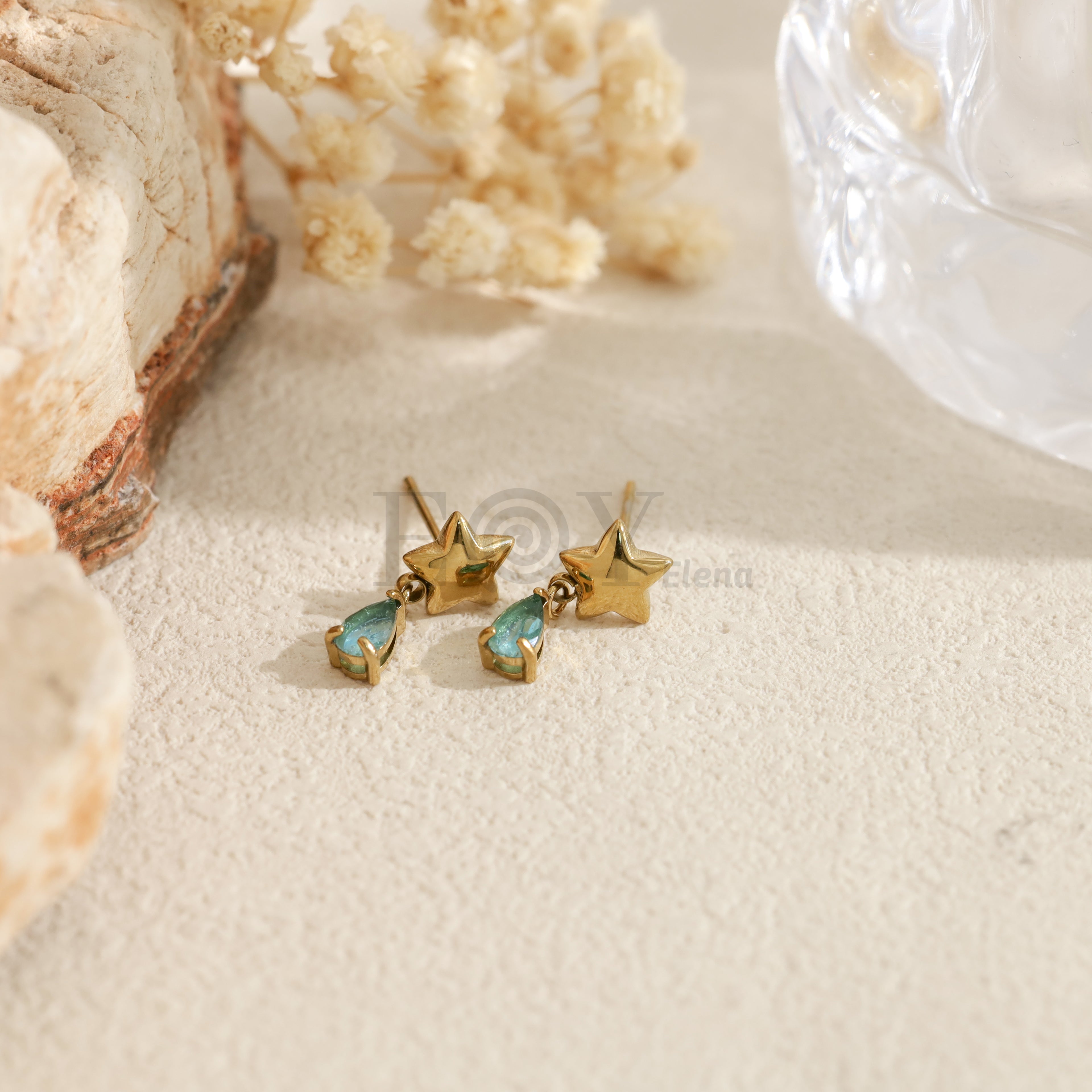 Pendientes con estrella y piedra en forma de lágrima