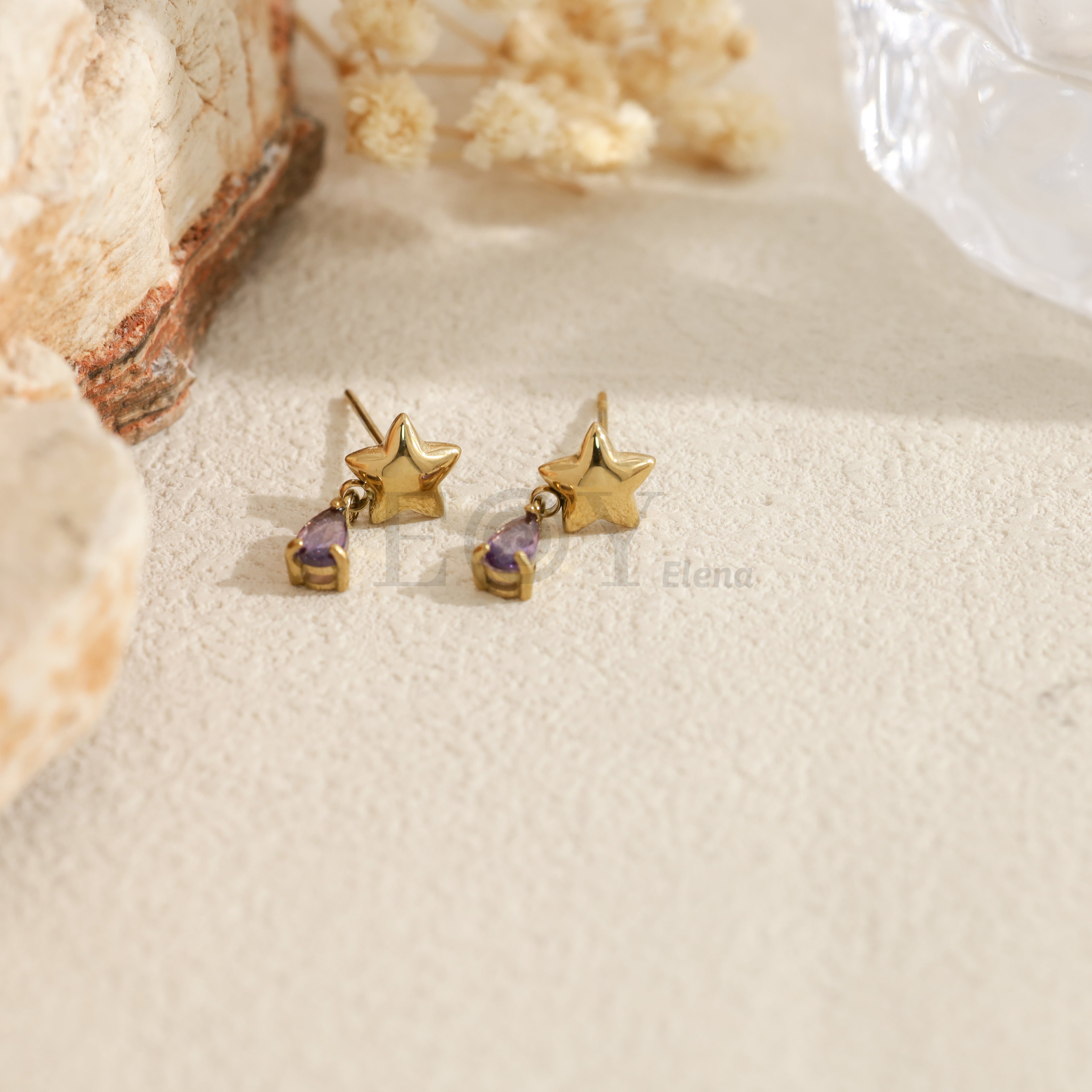 Pendientes con estrella y piedra en forma de lágrima