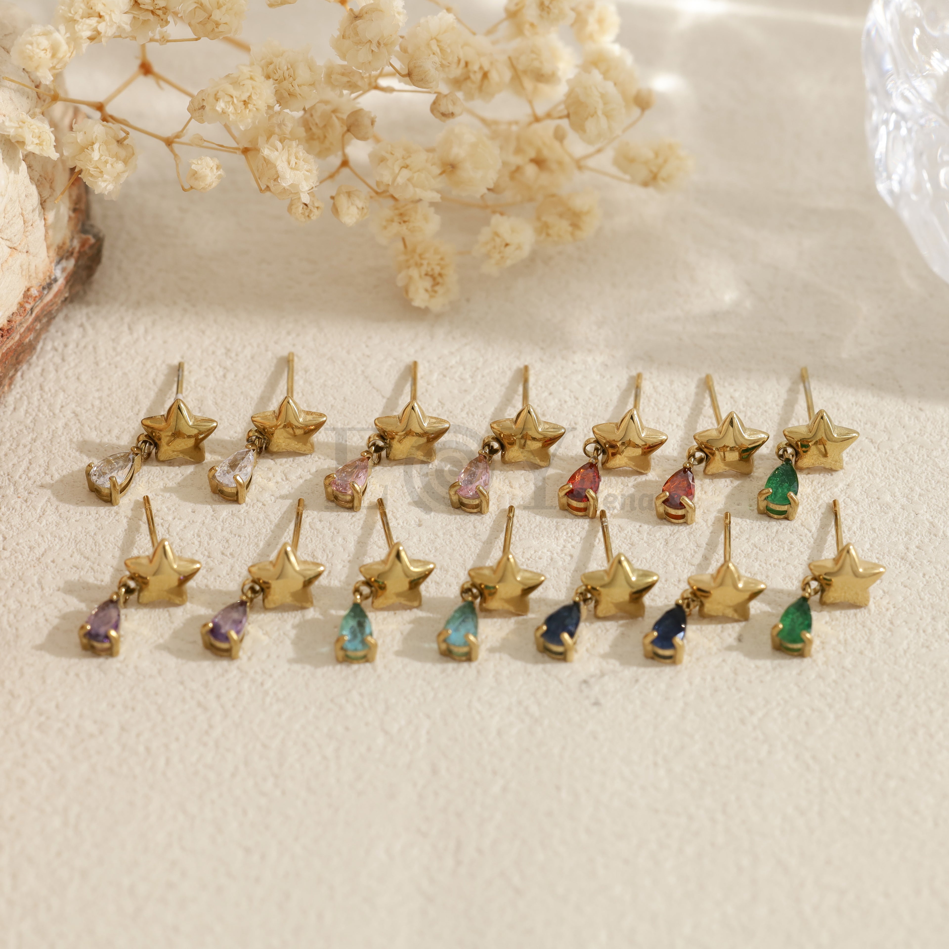 Pendientes con estrella y piedra en forma de lágrima