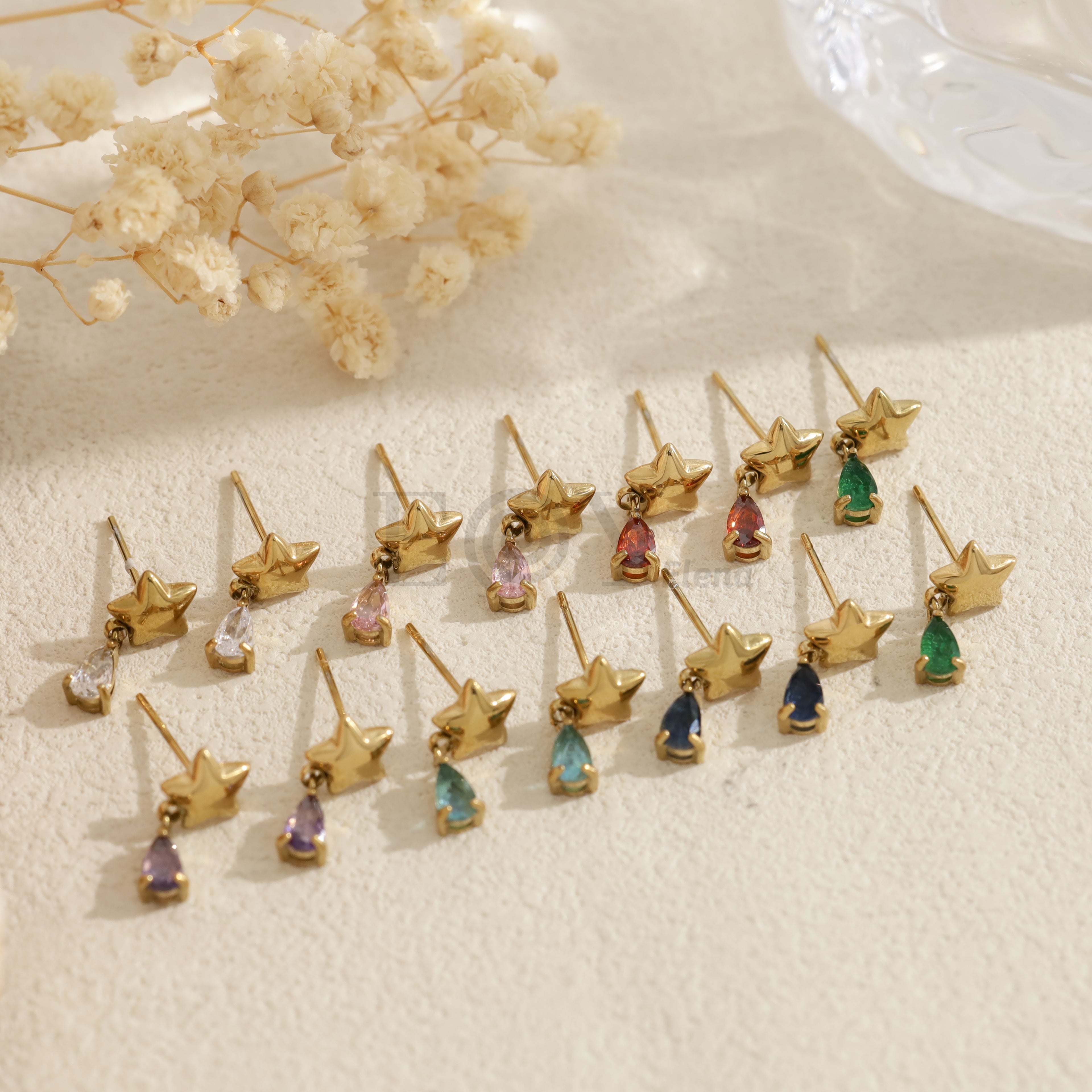 Pendientes con estrella y piedra en forma de lágrima