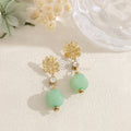 Pendientes flor con abalorio ovalado