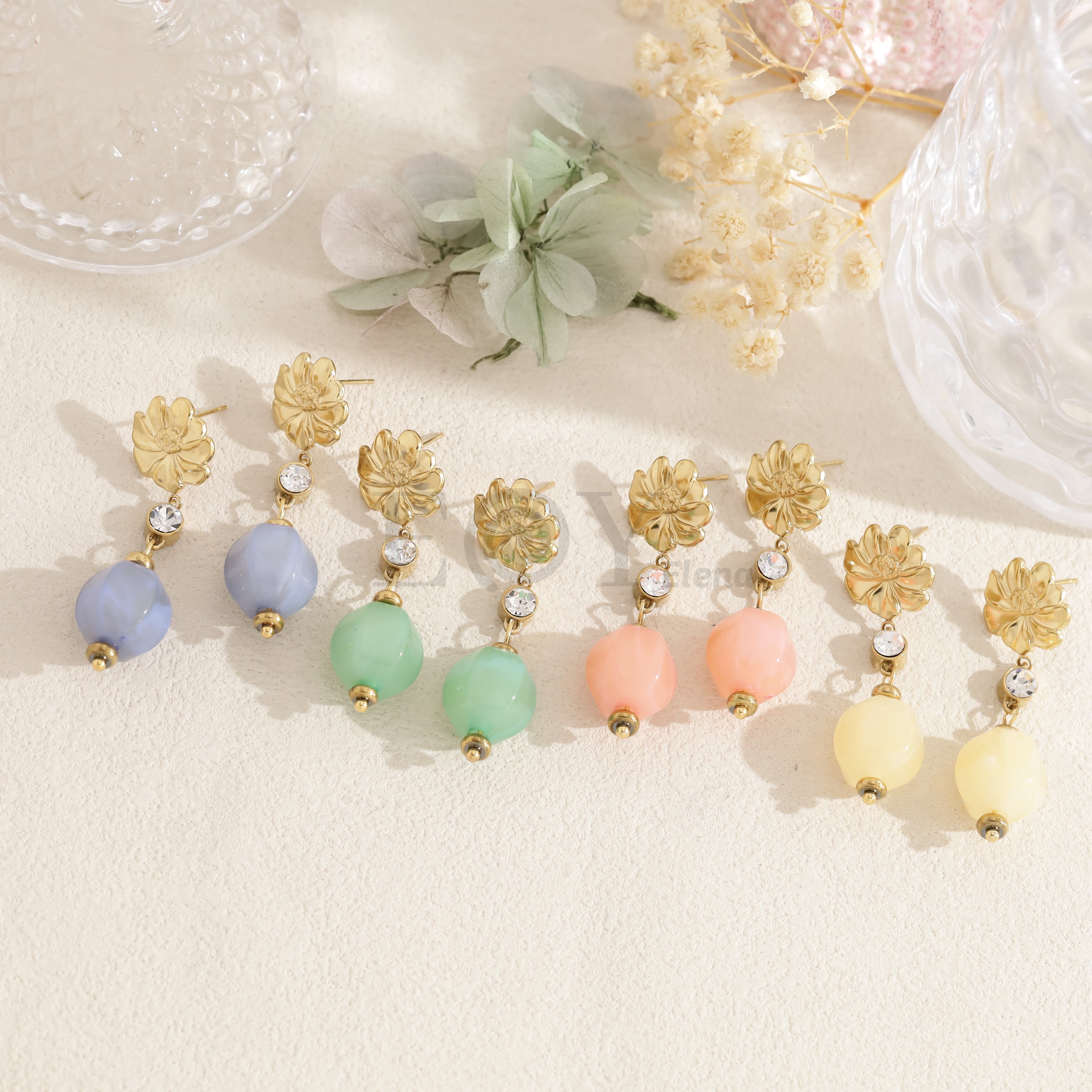 Pendientes flor con abalorio ovalado