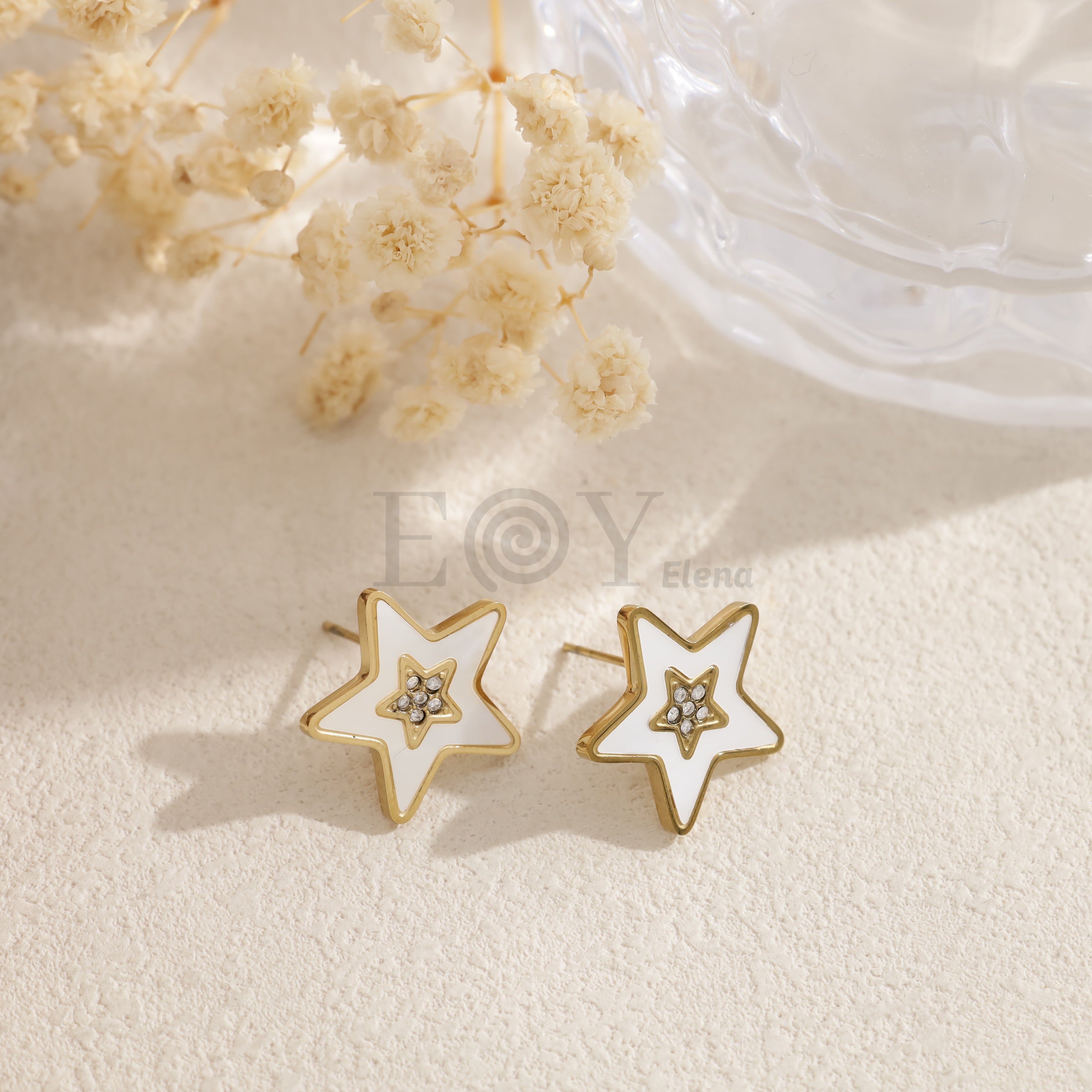 Pendientes estrella blanca dorada