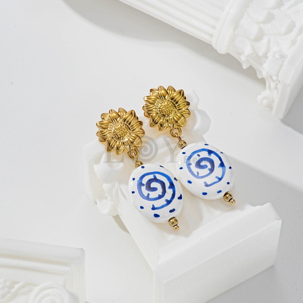 Pendientes flor y piedra con detalle azul