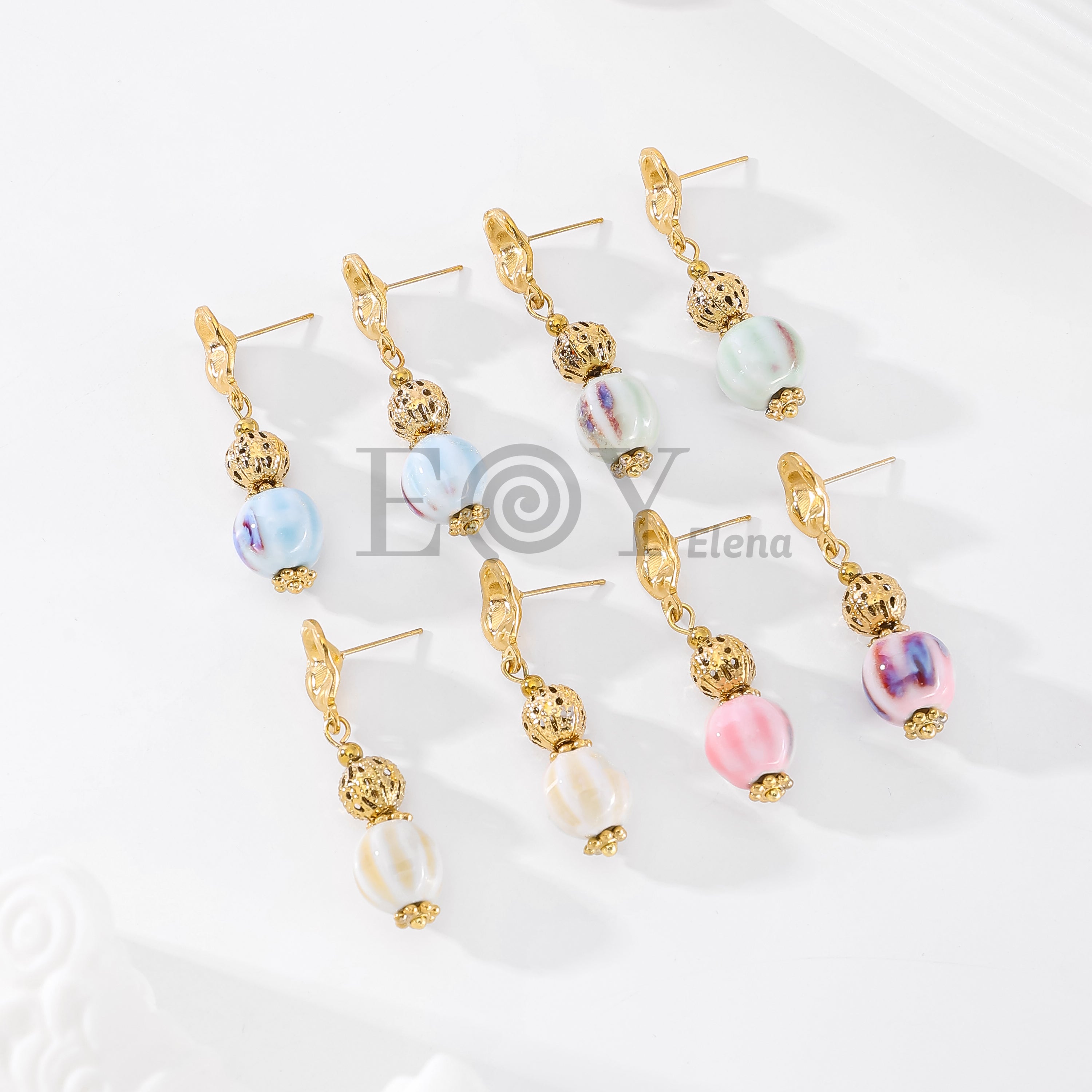 Pendientes óvalo texturizado chapa y piedra color