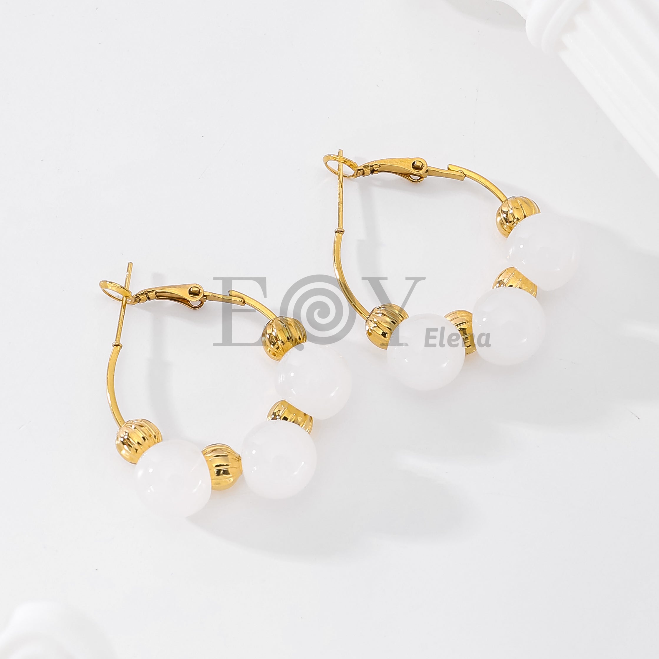 Pendientes de aro con piedras redondas