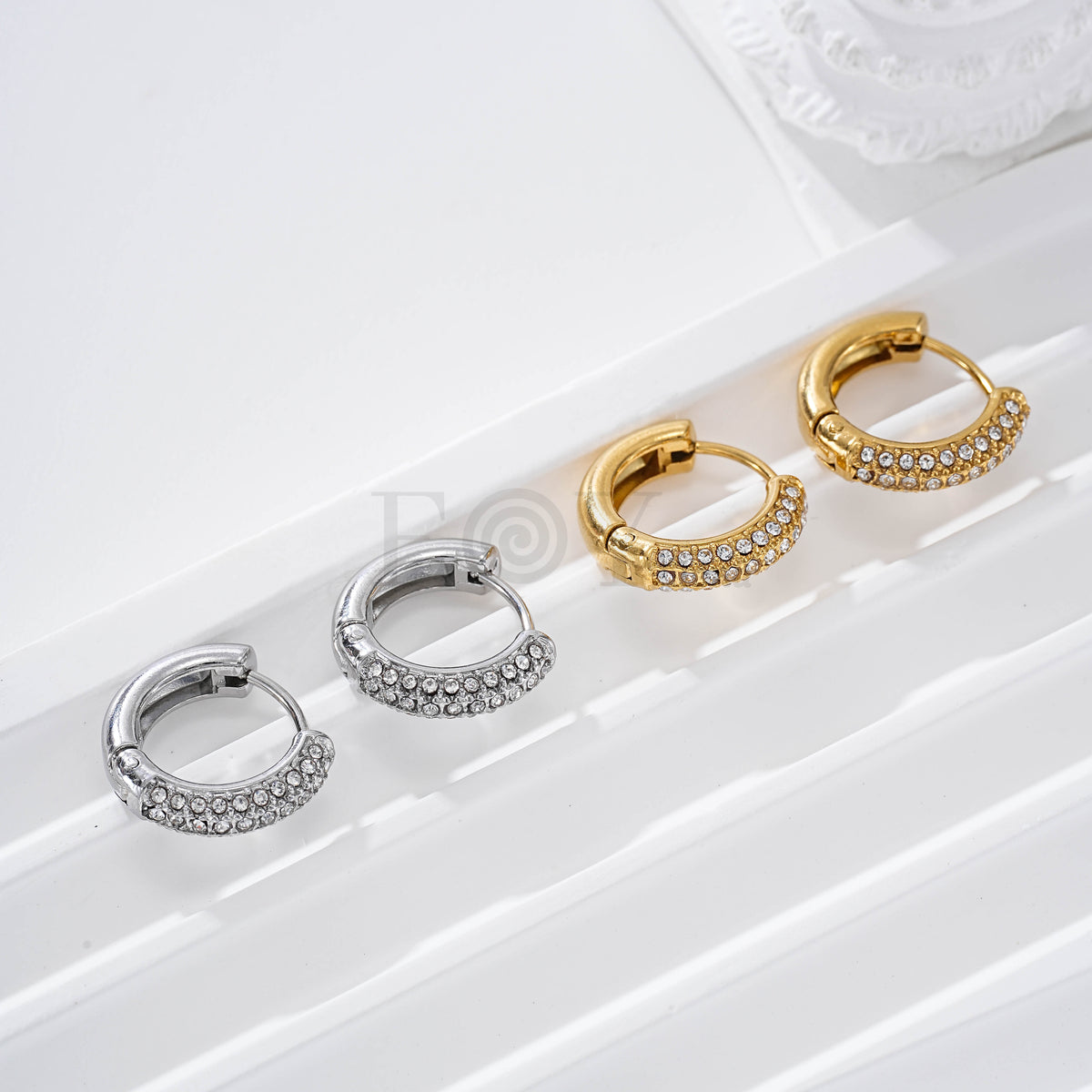 Aros con mitad circonitas acero
