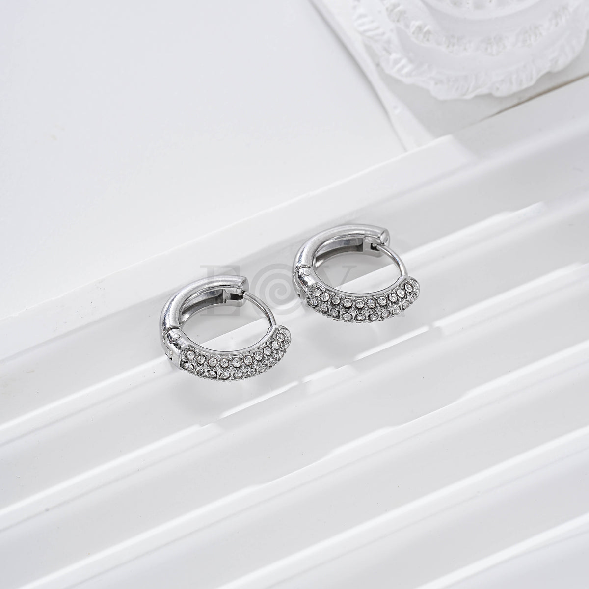 Aros con mitad circonitas acero