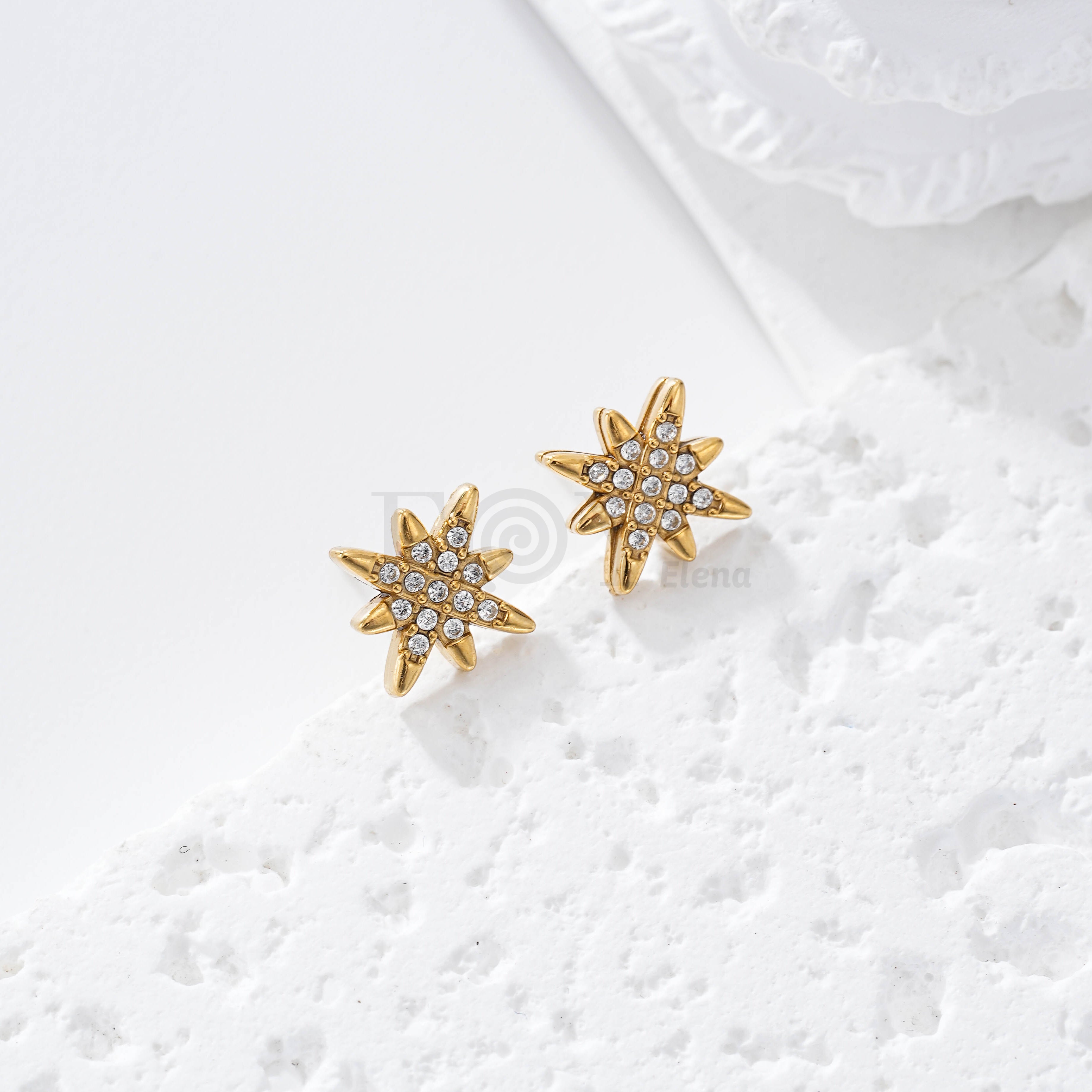 Pendientes estrella circonitas acero
