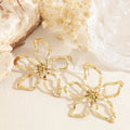 Pendientes flor calada acero
