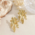 Pendientes flor alargada dorada