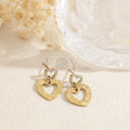 Pendientes doble corazón hueco acero