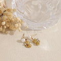Pendientes perla con gato acero