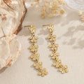 Pendientes colgantes de flores doradas