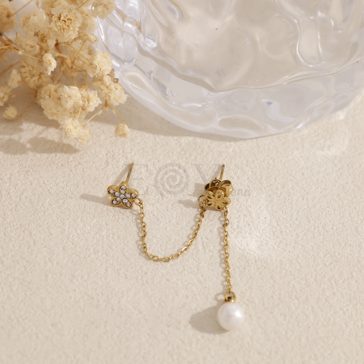 Pendiente flor doble agujero con perla acero