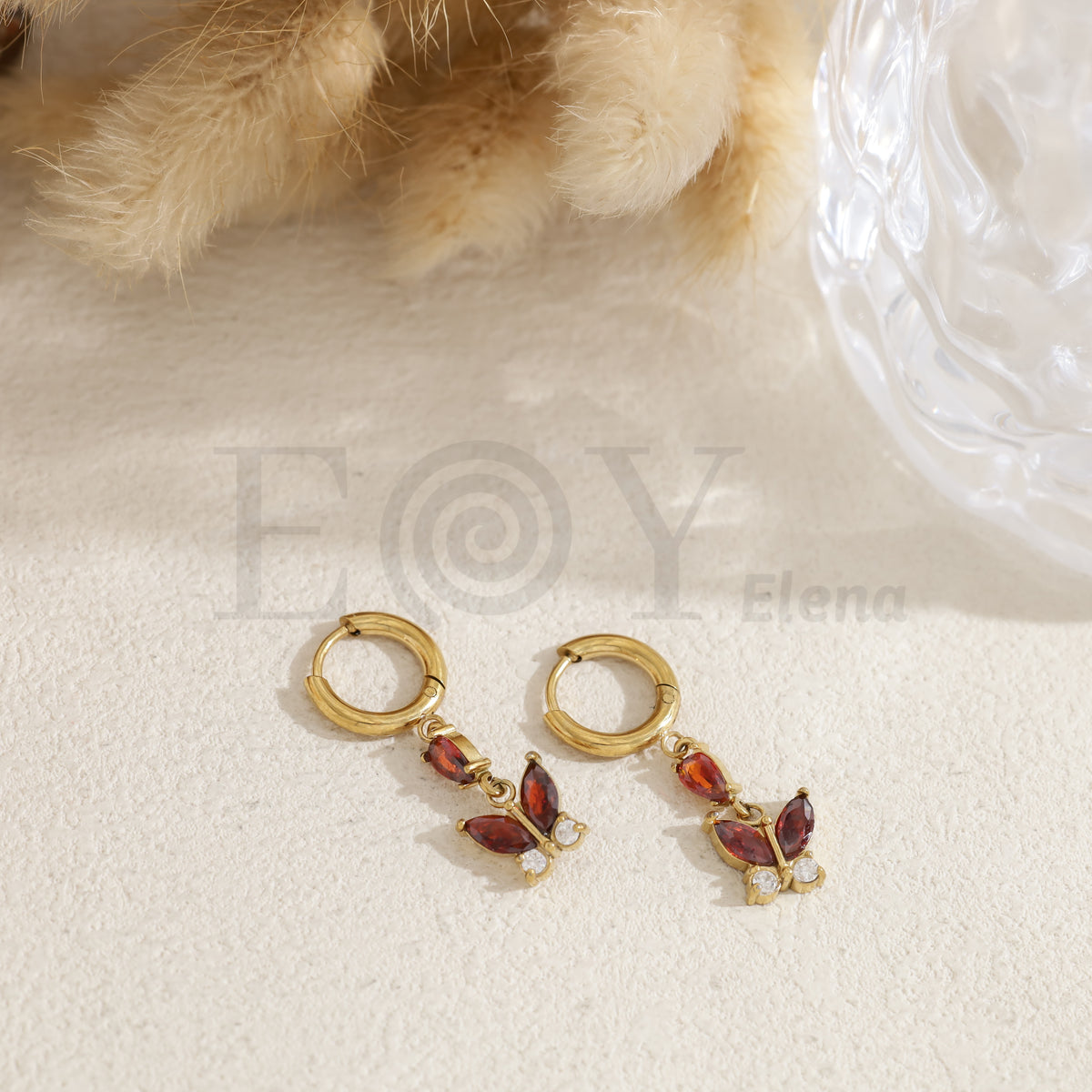 Pendientes de aro con mariposa color acero