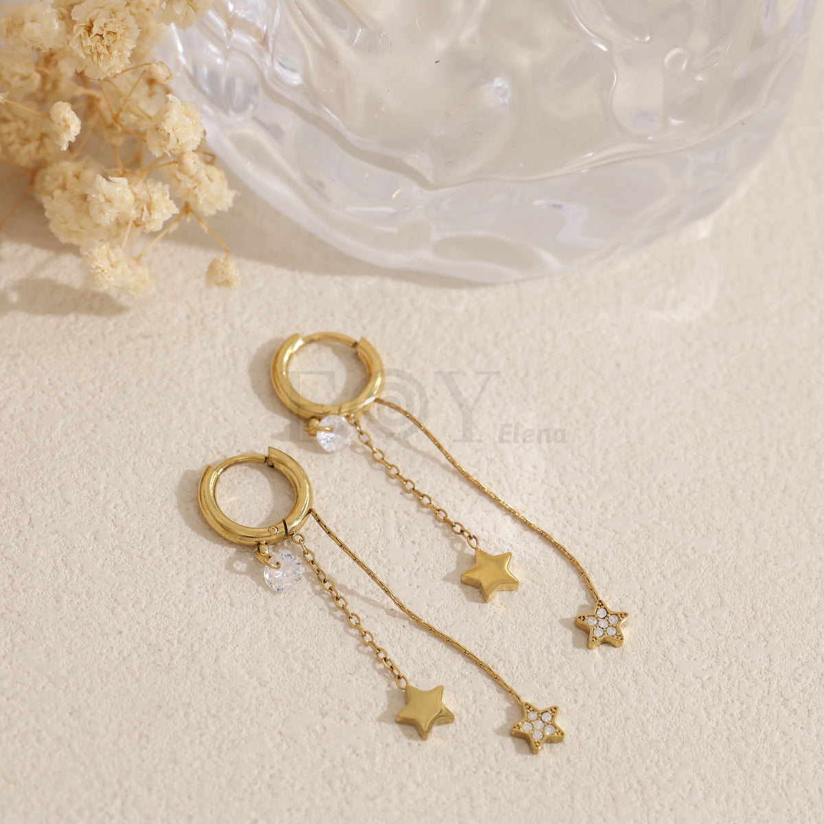 Pendientes de aro con estrellas colgando acero