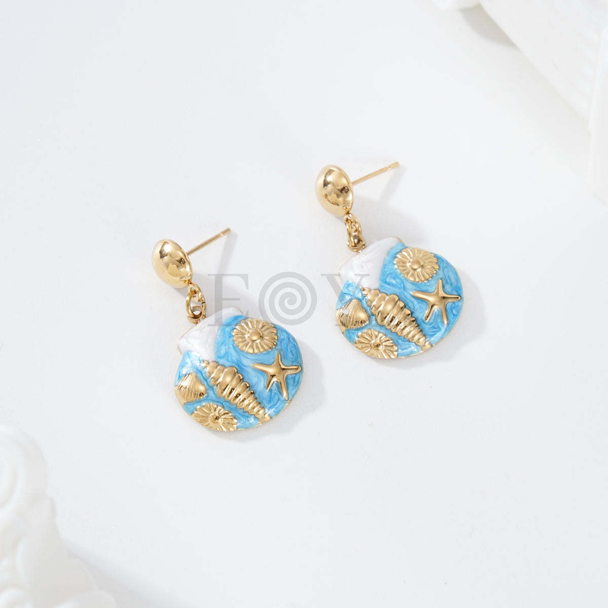 Pendientes concha con detalles marinos