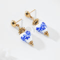 Pendientes con piedra blanca y detalles azules