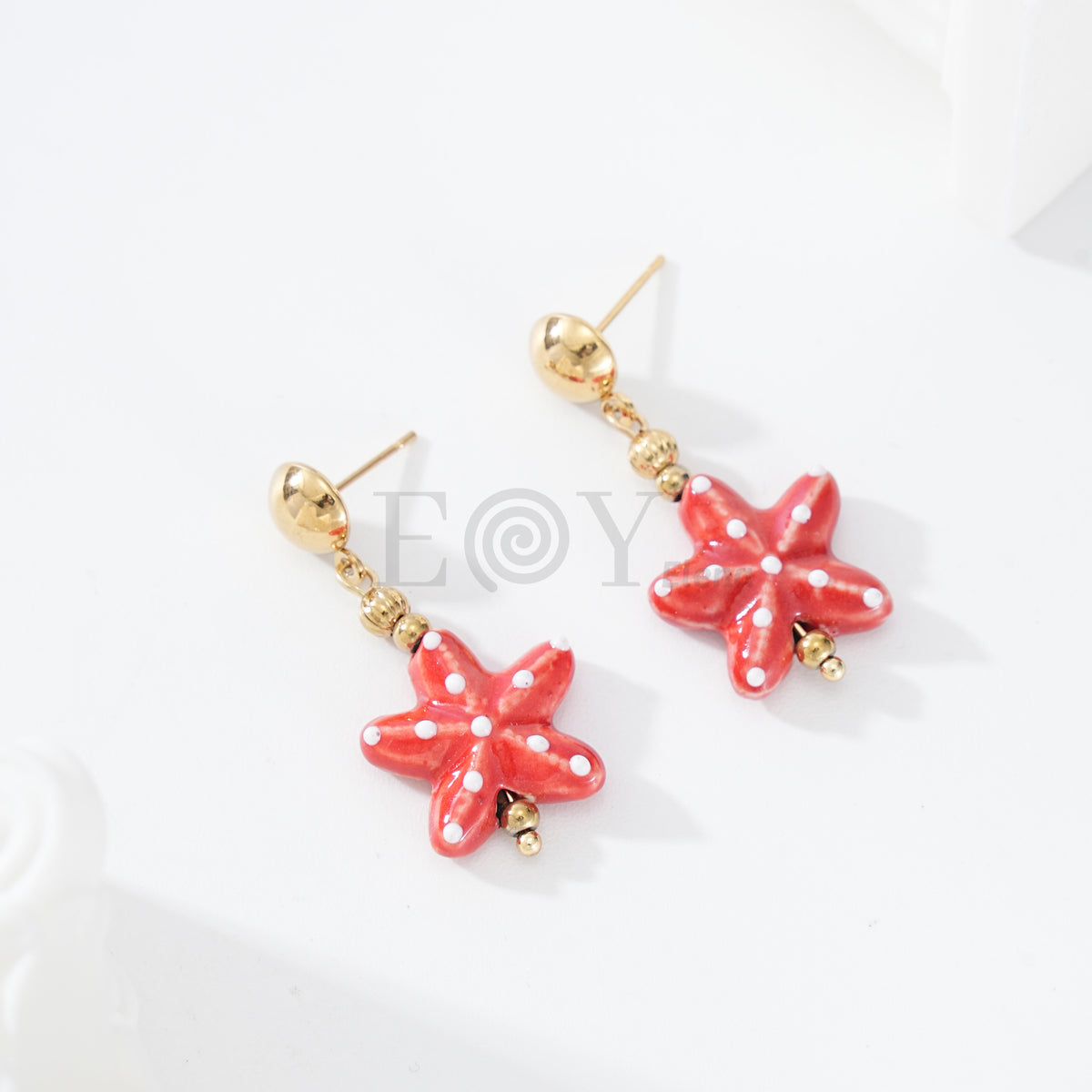 Pendientes colgante estrella mar color