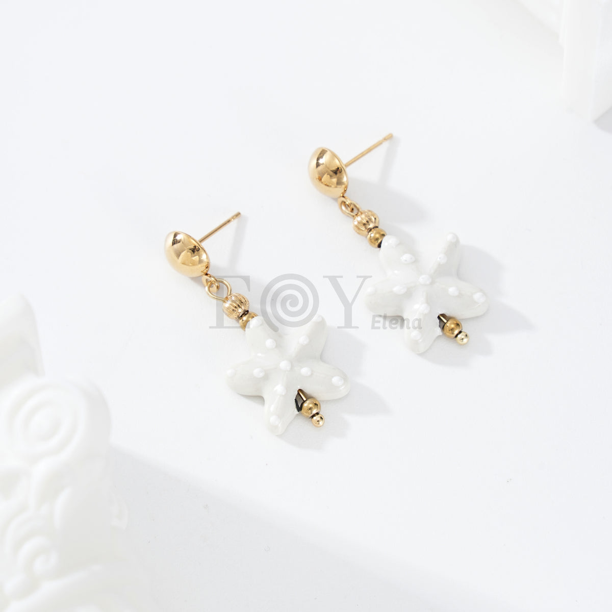 Pendientes colgante estrella mar color