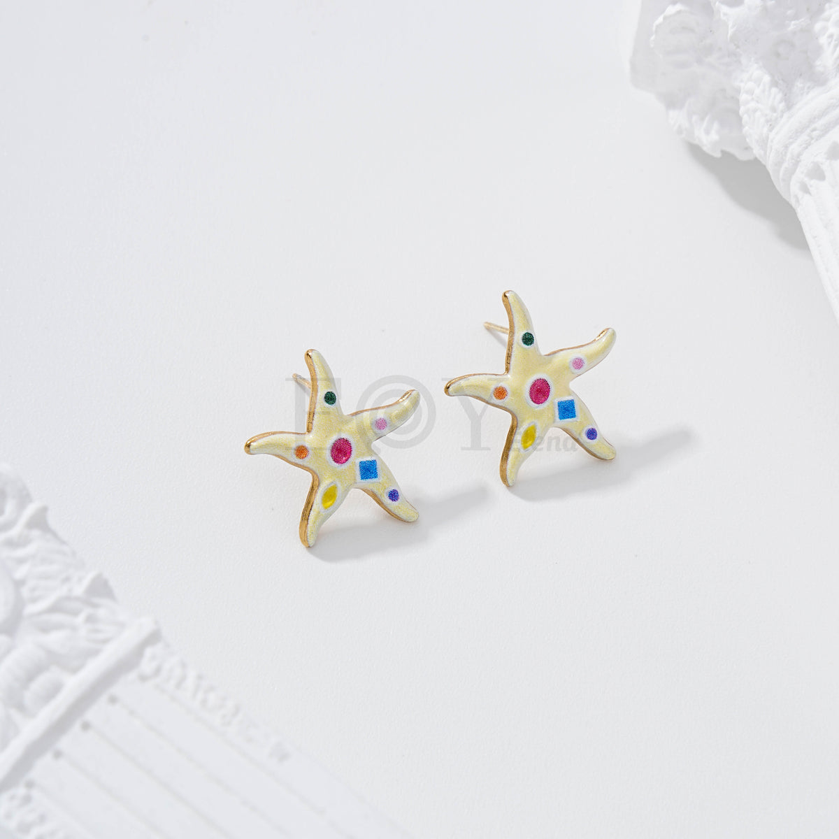 Pendientes estrella de mar con figuras geométricas