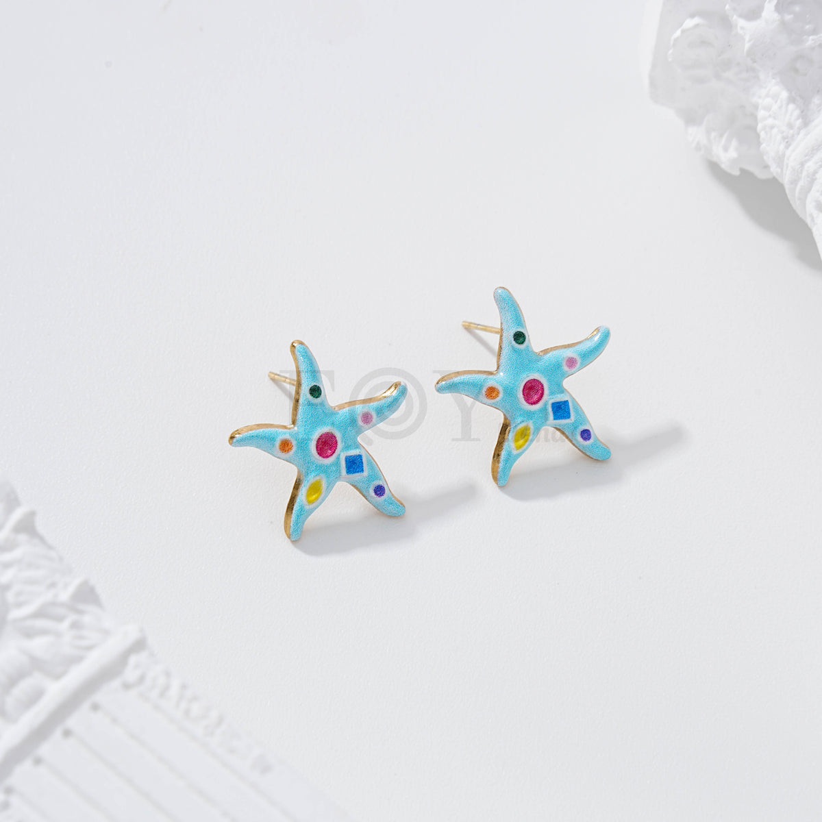 Pendientes estrella de mar con figuras geométricas