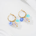 Pendientes de pez y charms marinos