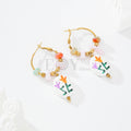 Pendientes aro con piedras y charm flores