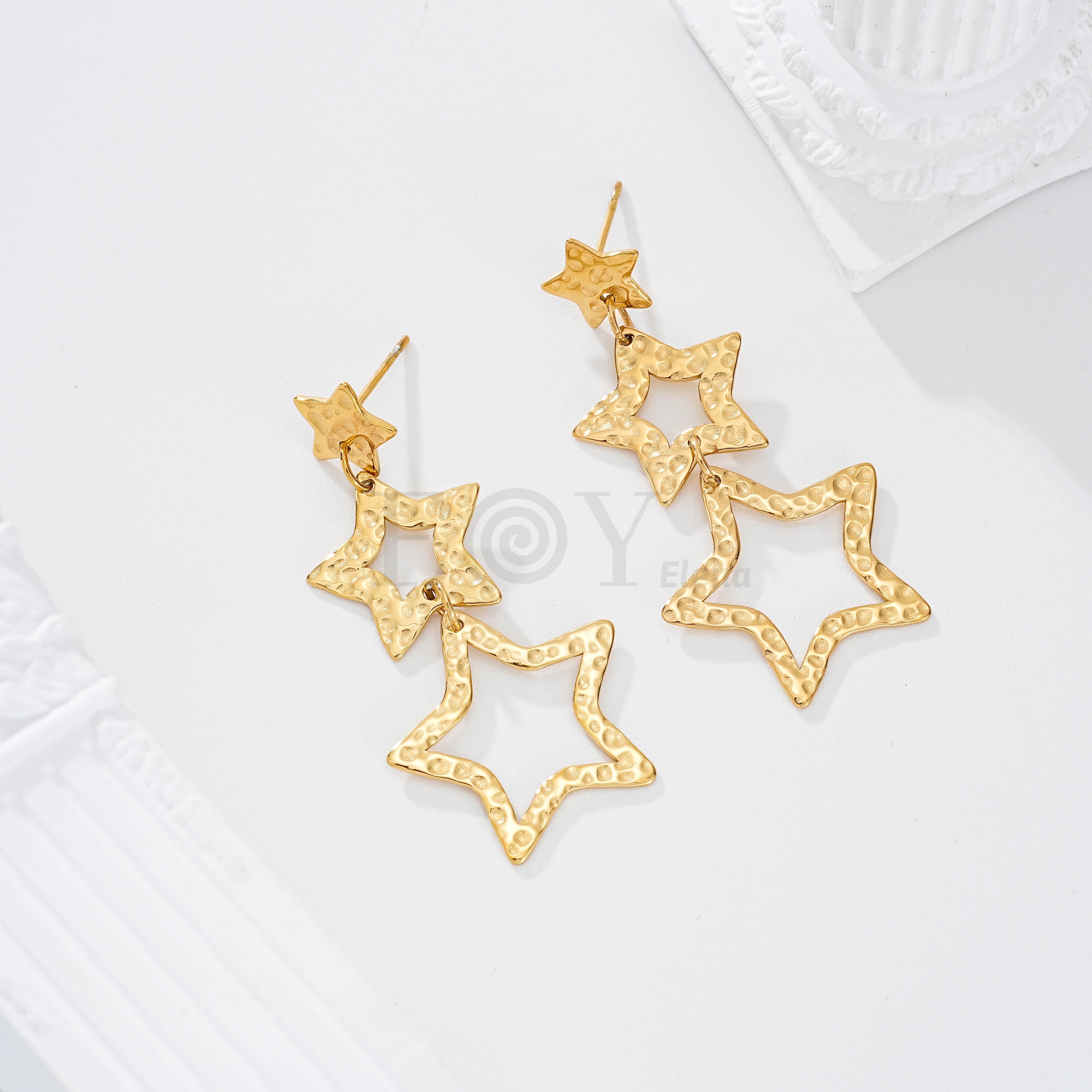 Pendientes triple aro estrella textura