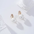 Pendientes circonita y perla cierre omega goldfield