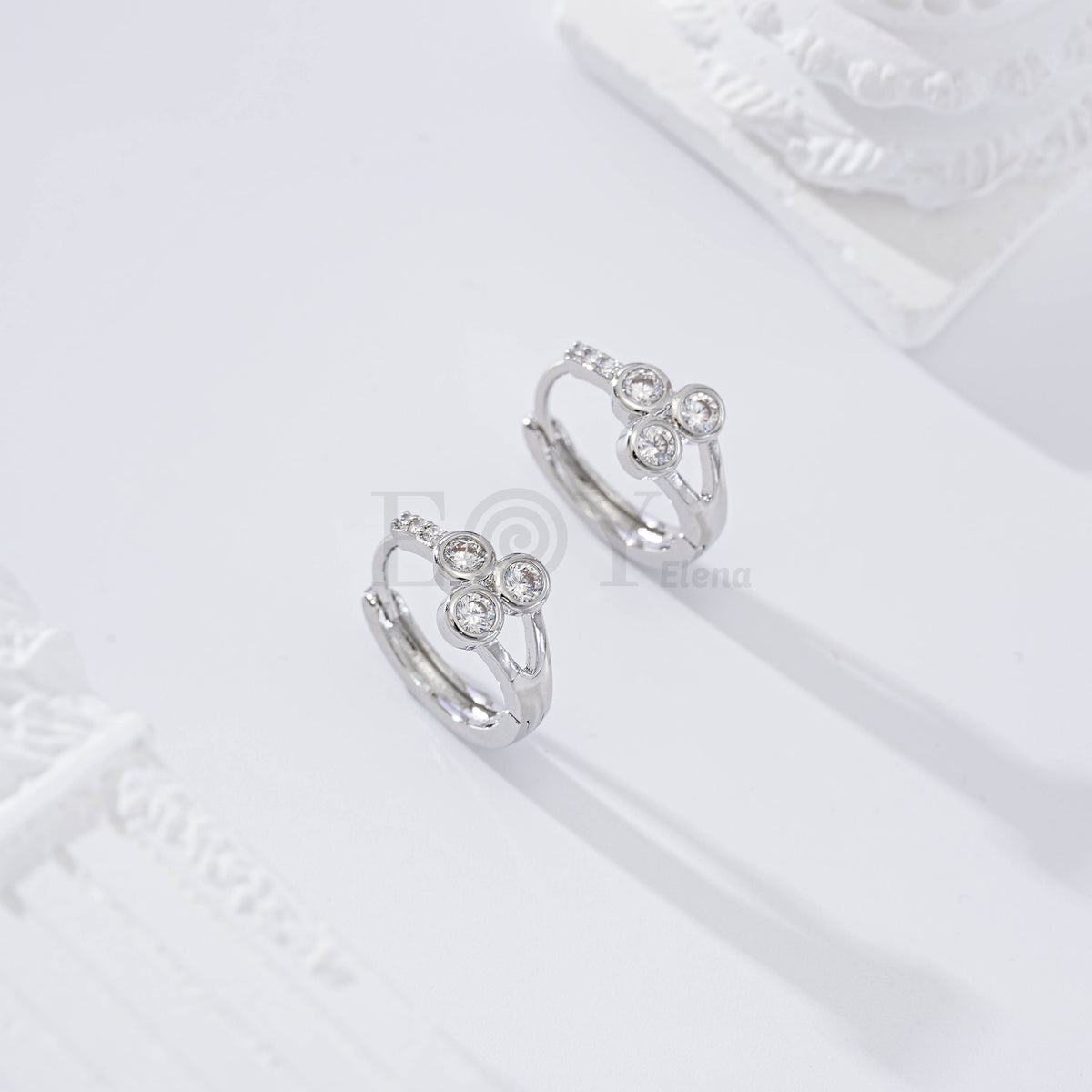 Gold-filled hoop with three cubic zirconias