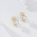 Pendientes flor y perla cierre omega goldfield