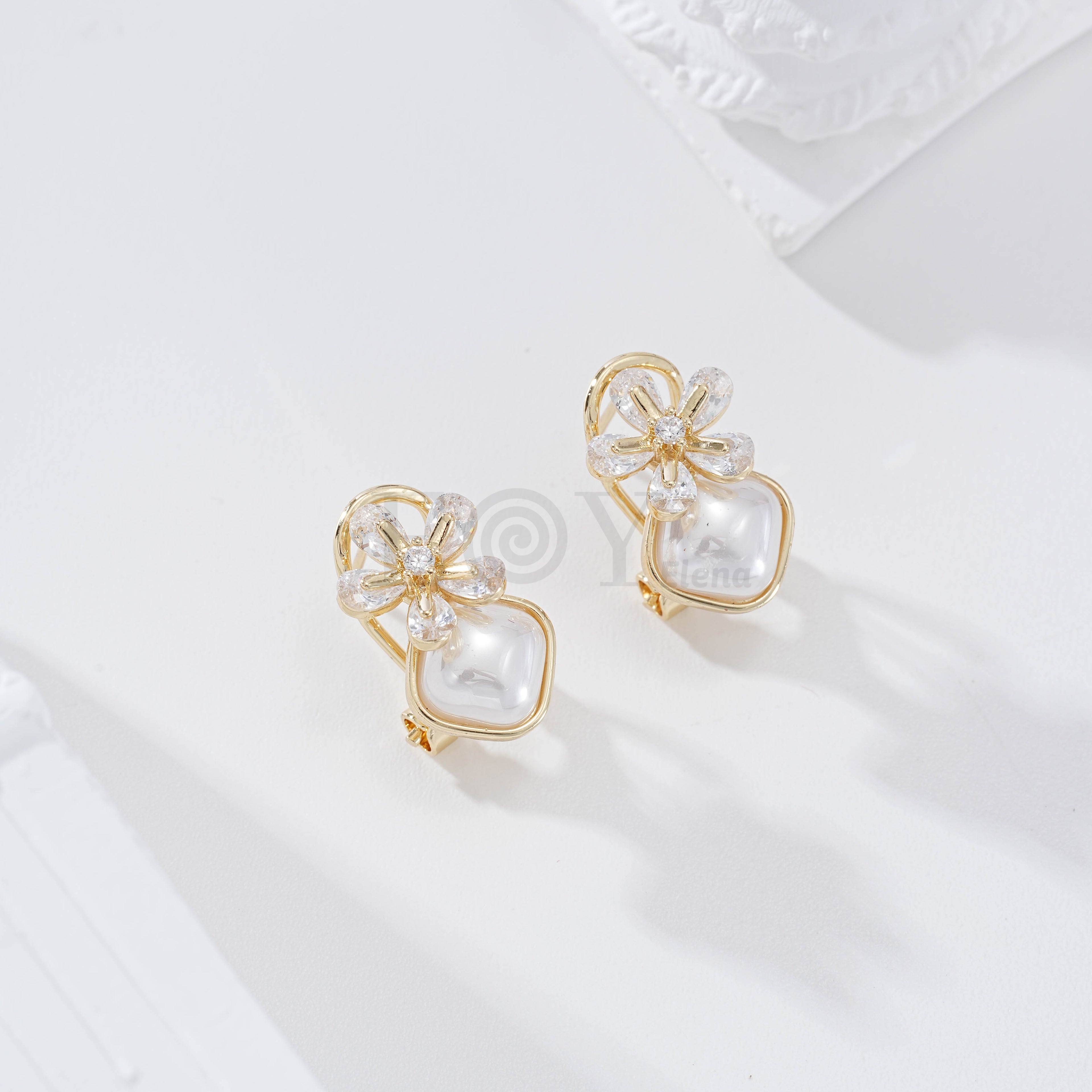 Pendientes flor y perla cierre omega goldfield