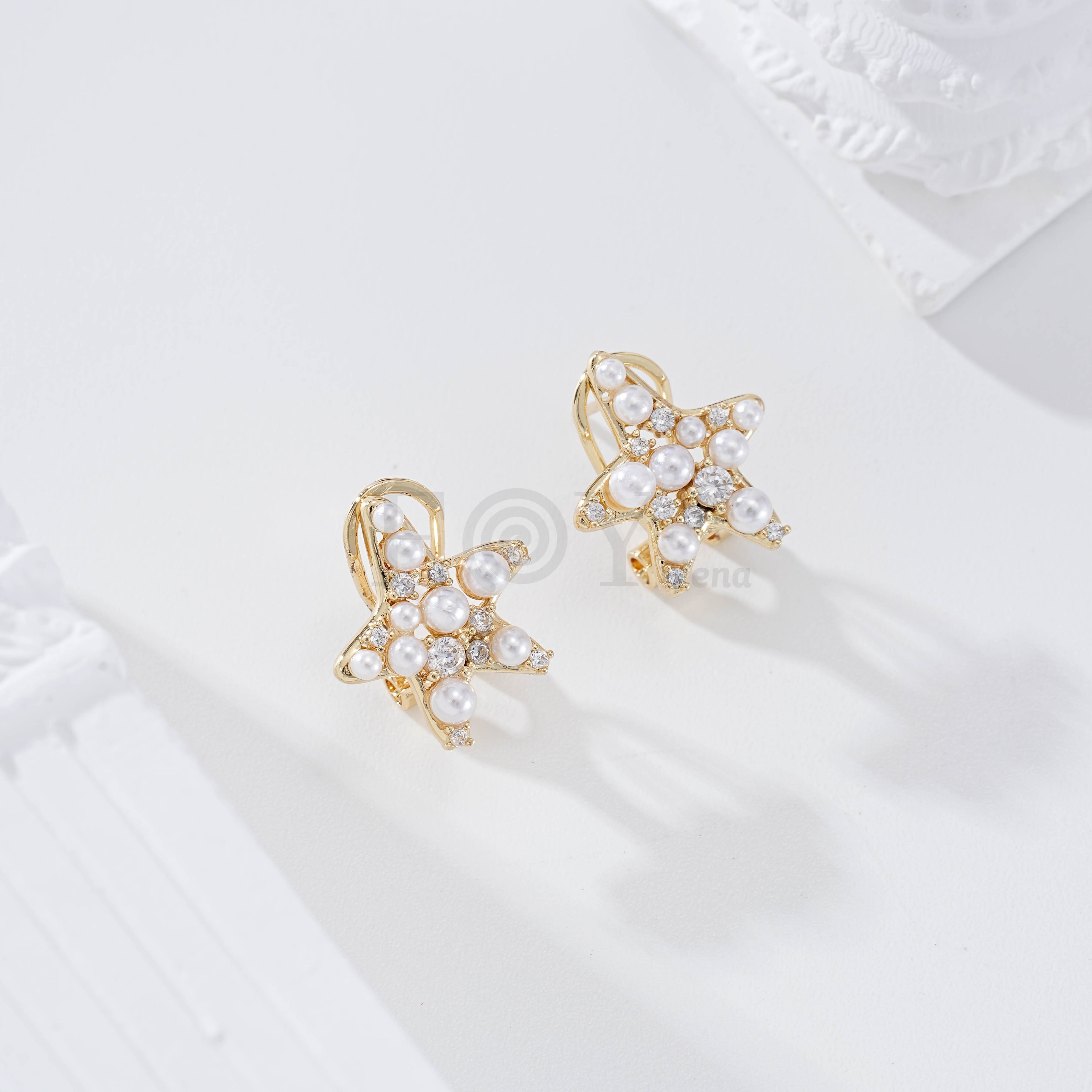 Pendientes estrella con perla cierre omega goldfield