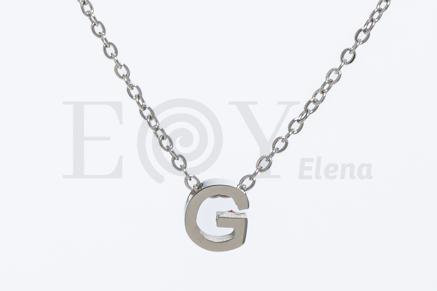 Collar de letra "G"
