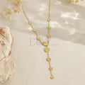 Collar largo con discos texturizados