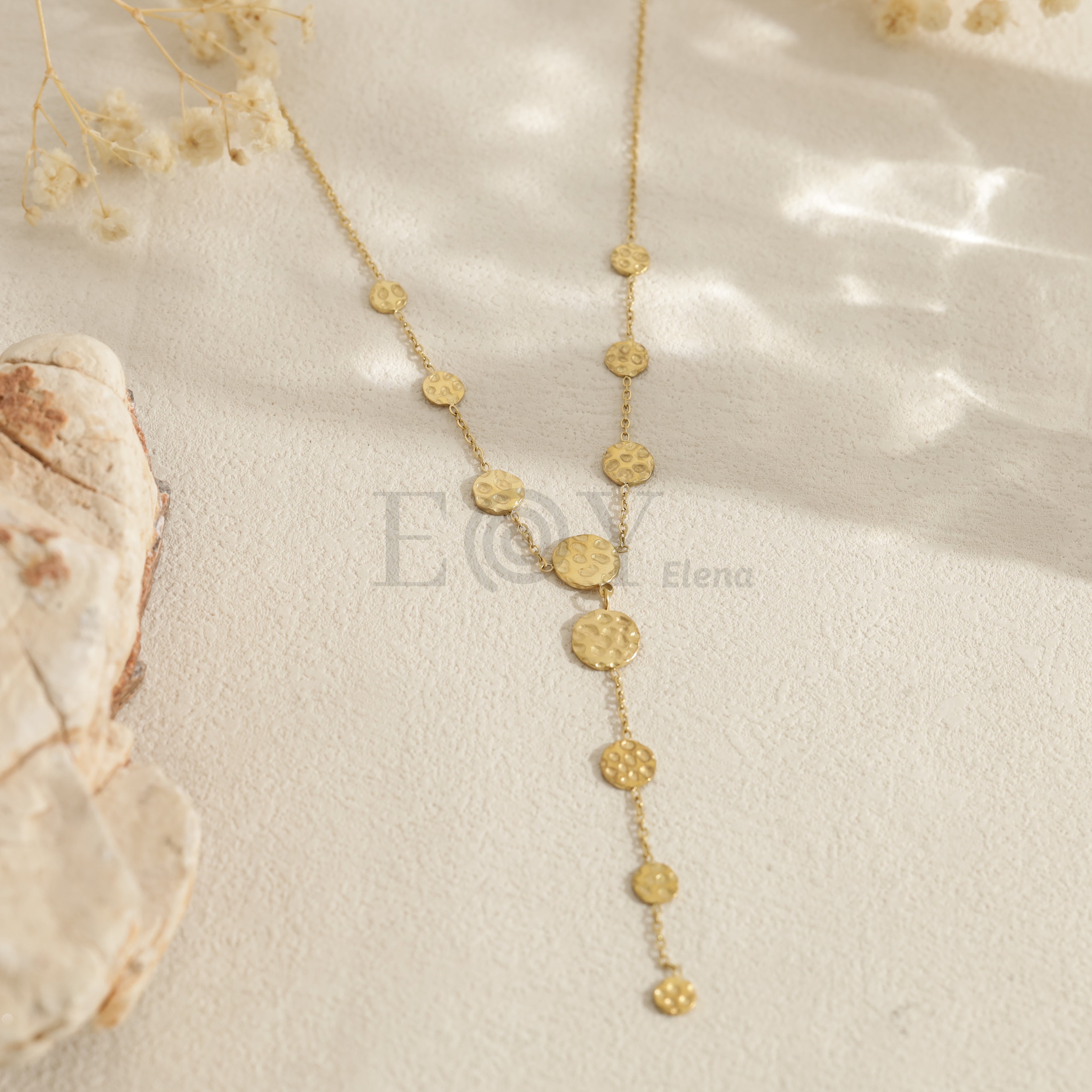 Collar largo con discos texturizados