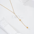 Collar circonita y cadena colgando