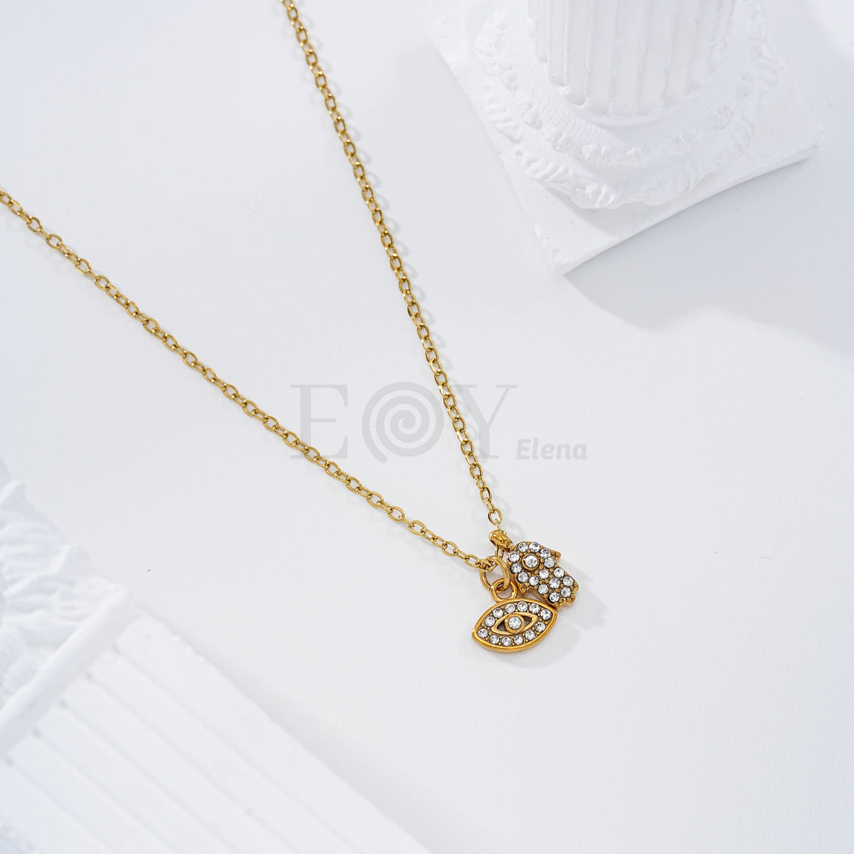 Collar con ojo circonitas y mano de Fátima acero