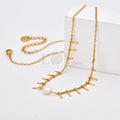 Collar Perla Central de Acero Dorado