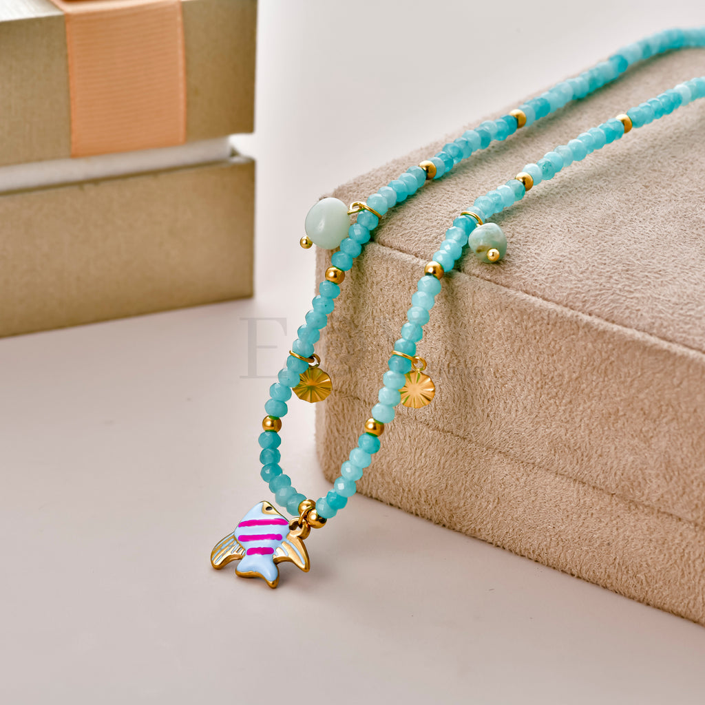 Collar bolitas turquesa y pez