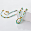Collar Virgen Milagrosa con piedras turquesas