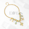 Collar con cruz y charms turquesas